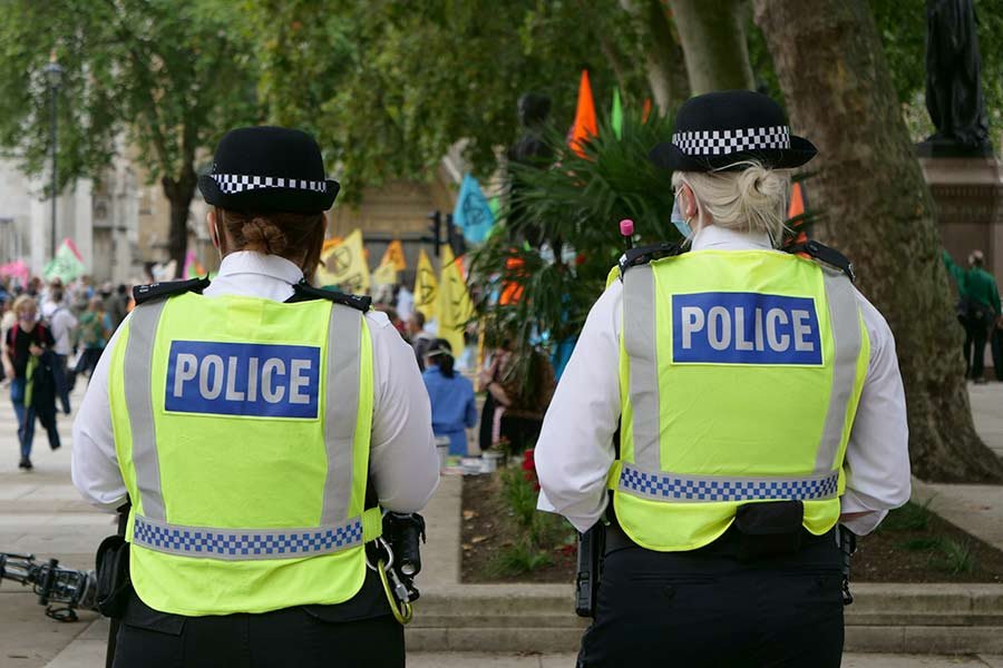 two uk police officers on patrol